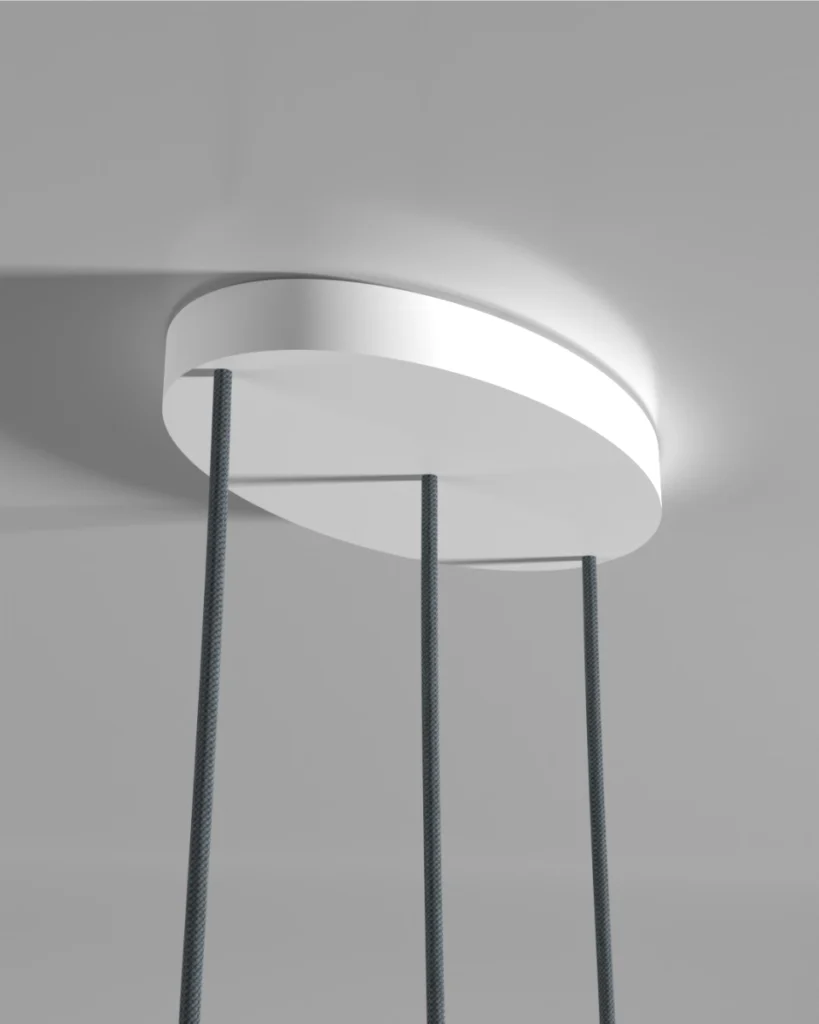 Detailed view of the Kaluma KIVO Trio Oval Cable Canopy crafted from sustainable PLA installed on a ceiling with the cables.